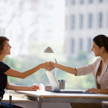 Businesswomen shaking hands